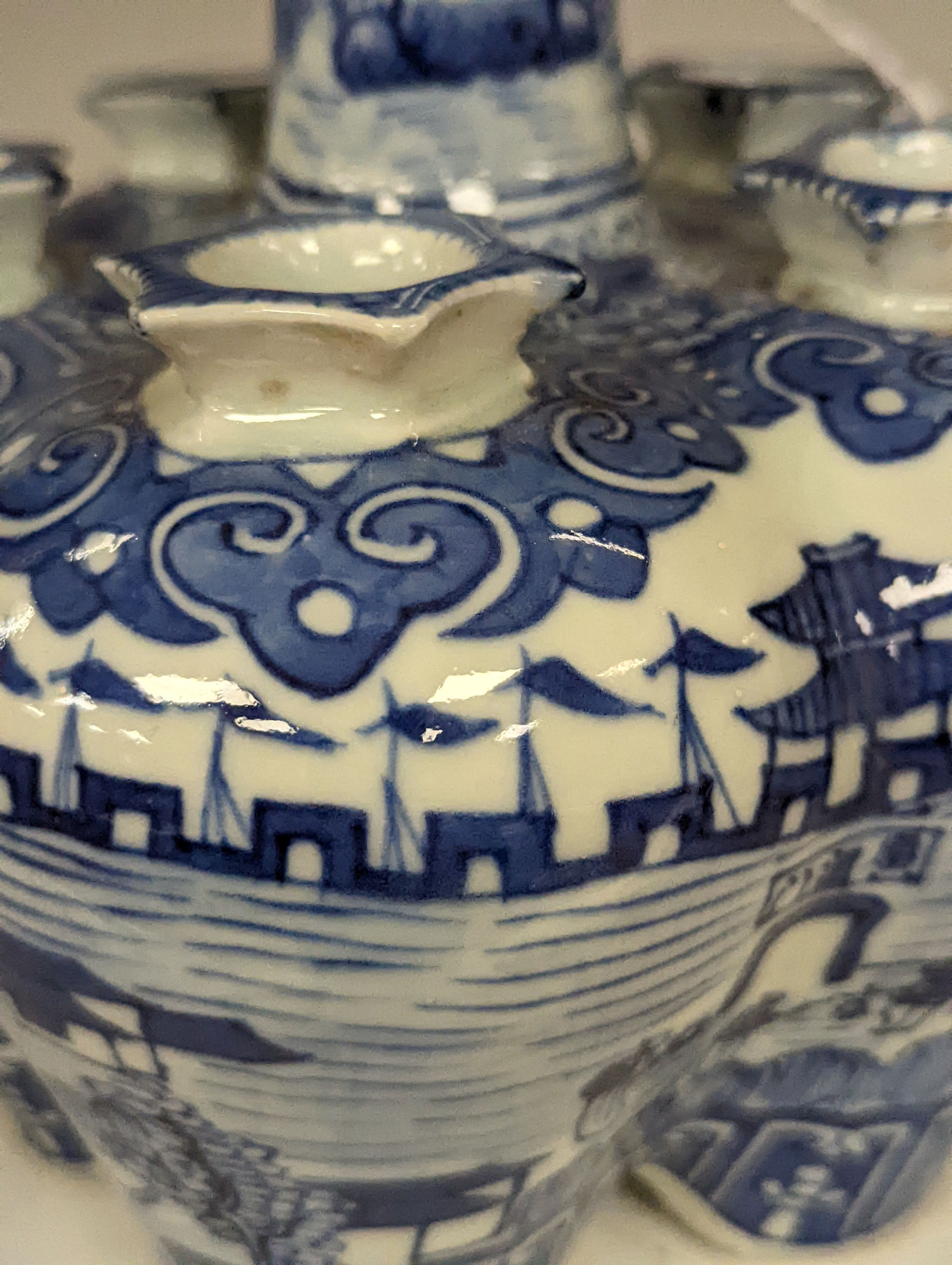 A 19th century Chinese blue and white tulip vase, painted with the pavilion of Prince Teng - 24cm high